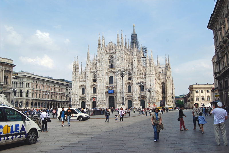 25 - The magnificent Milan Cathedral (Duomo di Milano) towering over the bustling Piazza del Duomo in the historic center of Milan